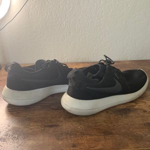 Men’s black Nike running shoes.